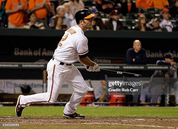 Hardy of the Baltimore Orioles follows his game winning two RBI single against the Seattle Mariners during the twelfth inning at Oriole Park at...