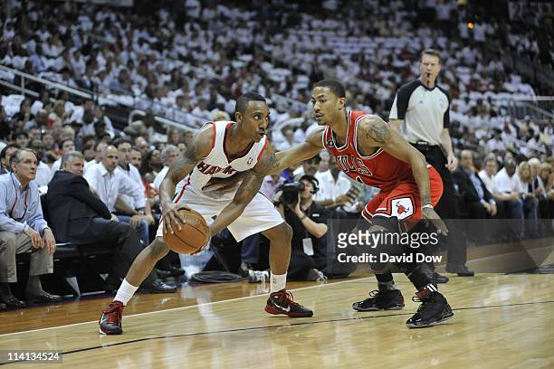 Jeff Teague of the Atlanta Hawks looks to drive against Derrick Rose of the Chicago Bulls during Game Six of the Eastern Conference Semifinals in the...