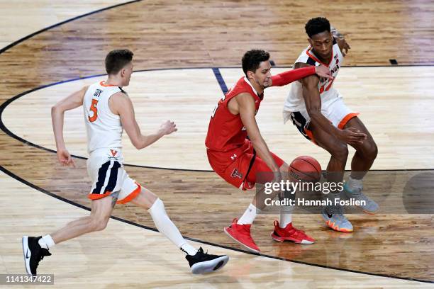 Davide Moretti of the Texas Tech Red Raiders is defended by \v5 during the 2019 NCAA men's Final Four National Championship game at U.S. Bank Stadium...