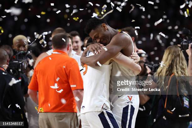 De'Andre Hunter and Kyle Guy of the Virginia Cavaliers celebrate their teams 85-77 win over the Texas Tech Red Raiders to win the the 2019 NCAA men's...