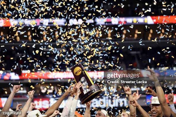 The Virginia Cavaliers celebrate with the NCAA trophy after their teams 85-77 win over the Texas Tech Red Raiders to win the the 2019 NCAA men's...