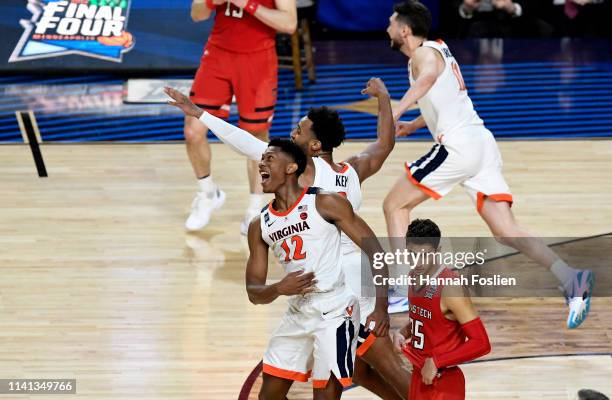 De'Andre Hunter and Braxton Key of the Virginia Cavaliers celebrate their teams 85-77 win over the Texas Tech Red Raiders during the 2019 NCAA men's...