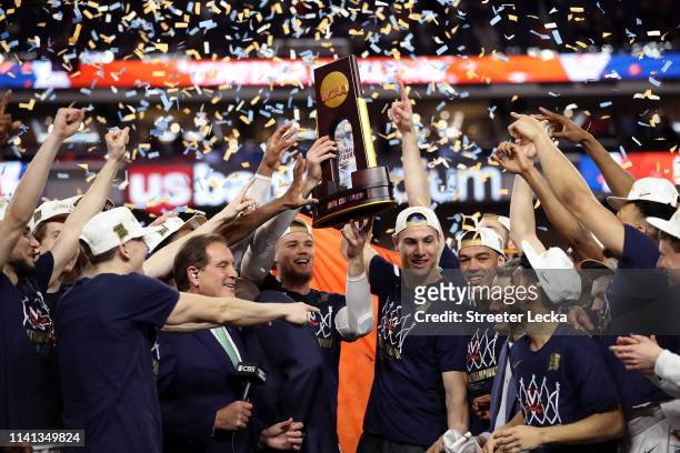 The Virginia Cavaliers celebrate with the trophy after their 85-77 win over the Texas Tech Red Raiders during the 2019 NCAA men's Final Four National...