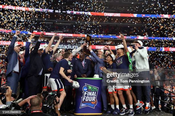 The Virginia Cavaliers celebrate with the trophy after their 85-77 win over the Texas Tech Red Raiders during the 2019 NCAA men's Final Four National...