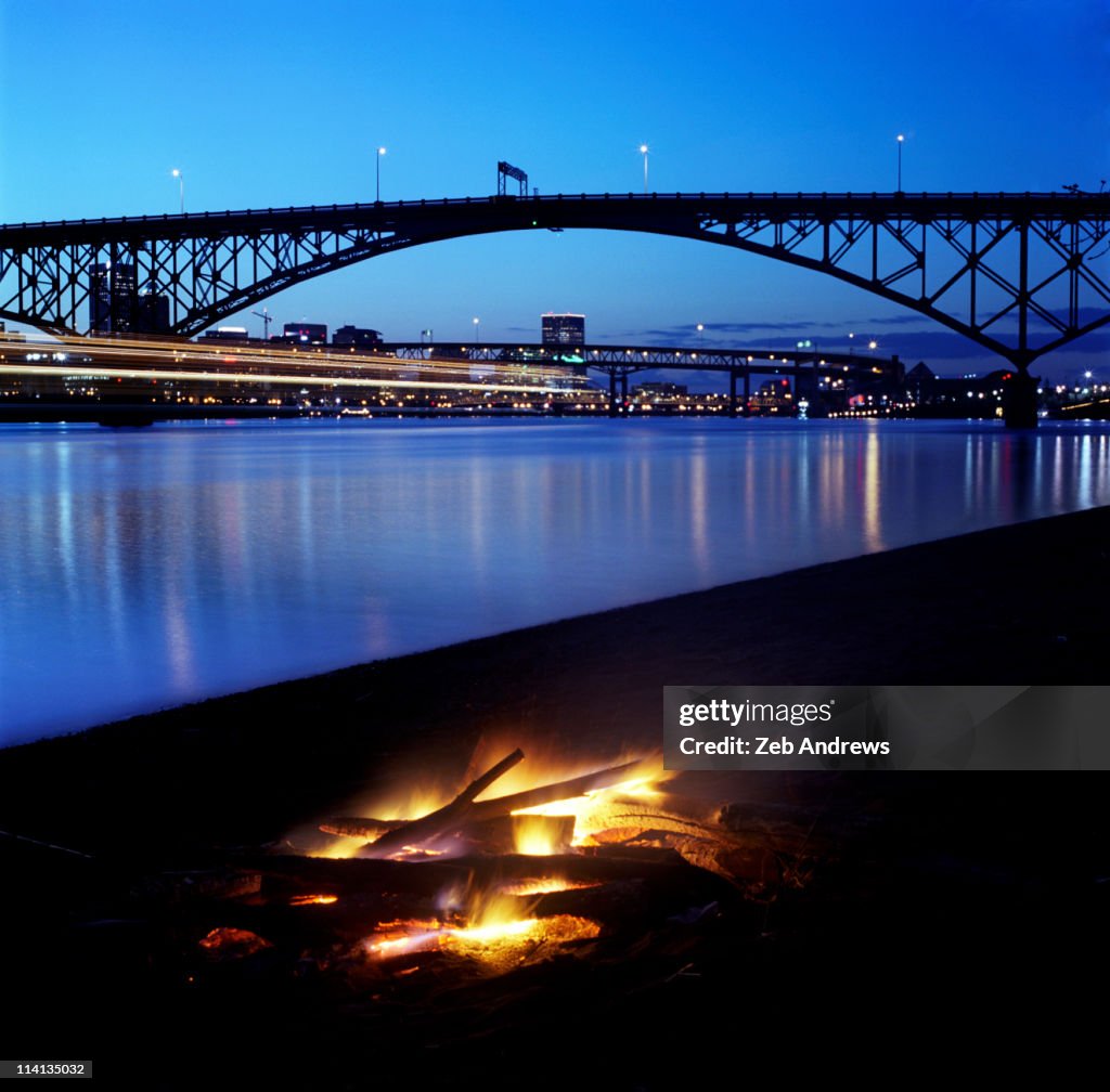 To build a fire in Portland, and then to watch it