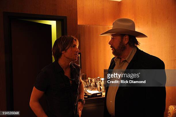 Keith Urban and Hank Williams Jr. Chat backstage during Music Builds: the CMT Disaster Relief Concert on May 12, 2011 in Nashville, Tennessee.