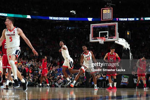 De'Andre Hunter and Braxton Key of the Virginia Cavaliers celebrate their teams 85-77 win over the Texas Tech Red Raiders during the 2019 NCAA men's...