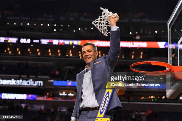 Head coach Tony Bennett of the Virginia Cavaliers raises the net after defeating the Texas Tech Red Raiders in the 2019 NCAA Photos via Getty Images...