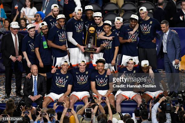 The Virginia Cavaliers celebrate with the trophy after their 85-77 win over the Texas Tech Red Raiders during the 2019 NCAA men's Final Four National...