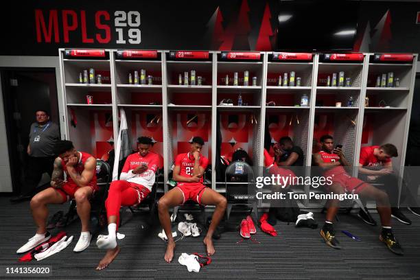 The Texas Tech Red Raiders react in the locker room after their 85-77 loss to the Virginia Cavaliers in the 2019 NCAA men's Final Four National...