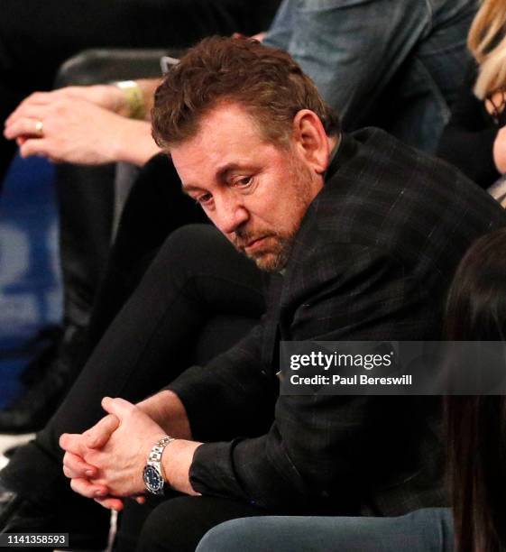 New York Knicks owner James Dolan reacts as he watches an NBA basketball game against the Toronto Raptors from his front row seat on March 28, 2019...