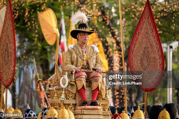 Thailand's newly crowned King Maha Vajiralongkorn is carried in a golden palanquin during the coronation procession on May 5, 2019 in Bangkok,...