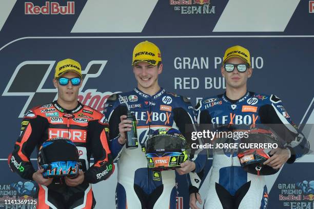 Race winner Flexbox HP 40's Italian rider Lorenzo Baldassarri celebrates on the podium with second placed Beta Tools Speed Up's Spanish rider Jorge...