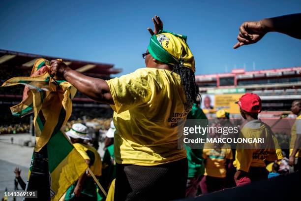 Supporters of the ruling party Africa National Congress gesture and chant slogans at the Ellis Park stadium in Johannesburg, on May 5, 2019 during...