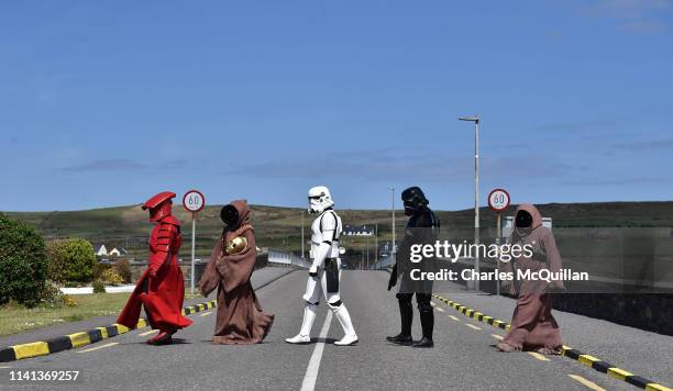 Members of the 501st Garrison Ireland Legion cross the bridge as they patrol the small fishing village on May 5, 2019 in Portmagee, Ireland. The...