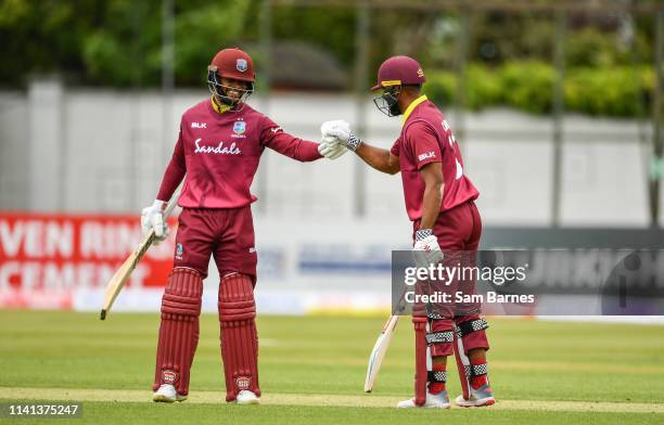 Dublin , Ireland - 5 May 2019; Shai Hope of West Indies, left, and John Campbell celebrate after both scoring half centuries during the One Day...