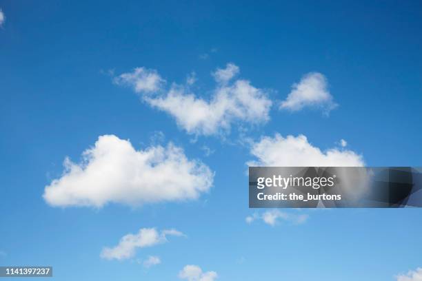 full frame shot of blue sky and clouds, abstract background - wolkengebilde stock-fotos und bilder