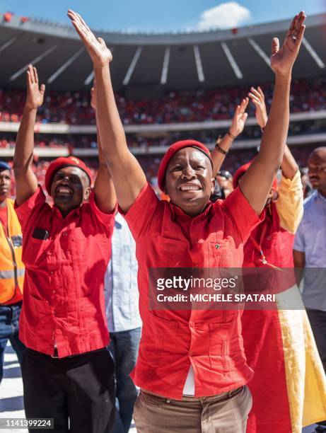 South Africa's radical left Economic Freedom Fighters opposition party leader Julius Malema acknowledges the crowd at the Orlando Stadium in Soweto,...
