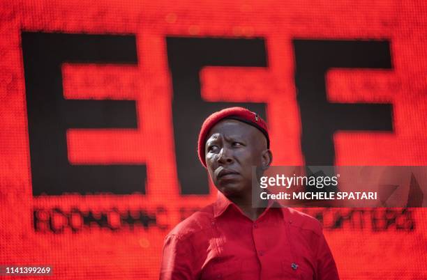 South Africa's radical left Economic Freedom Fighters opposition party leader Julius Malema overlooks the crowd at the Orlando Stadium in Soweto,...