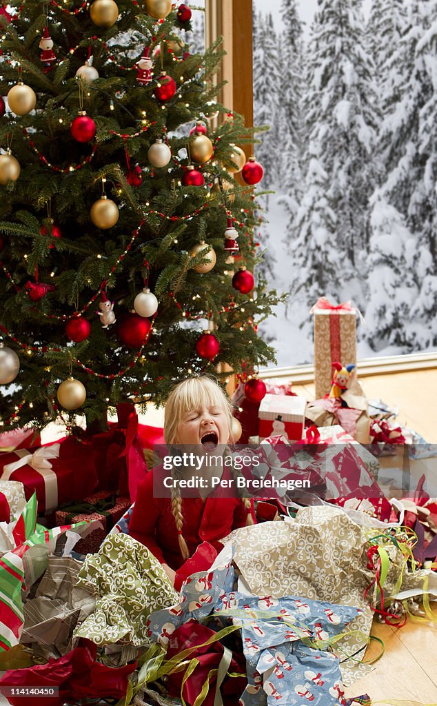 A girl crying after opening Christmas gifts