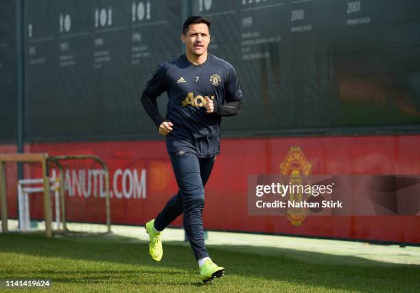Alexis Sanchez of Manchester United walks off after the Manchester United training session ahead of the UEFA Champions League Quarter Final First Leg...