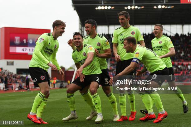 Kieran Dowell of Sheffield United celebrates with team mates after scoring a goal to make it 1-1 during the Sky Bet Championship match between Stoke...