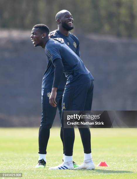 Paul Pogba of Manchester United shares a joke with Romelu Lukaku of Manchester United during the Manchester United training session ahead of the UEFA...