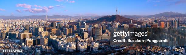 sunset scene of seoul downtown city skyline, aerial view of n seoul tower at namsan park in sunset - seoul skyline stock pictures, royalty-free photos & images