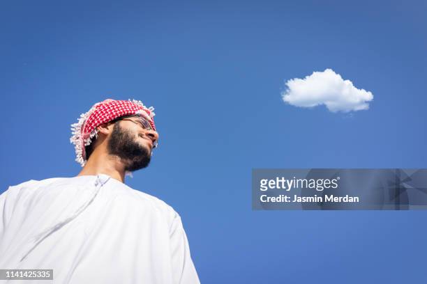 middle eastern man with cloud - islamic action front stock pictures, royalty-free photos & images