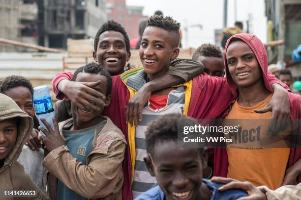 Addis Ababa, Ethiopia- Young Ethiopian boys laughing and smiling at the Addis Mercato, the largest open air market in Africa.