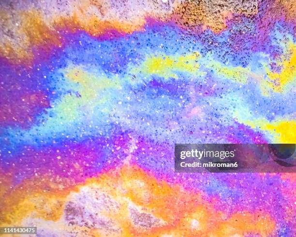 Rainbow Puddle Photos and Premium High-Res Pictures