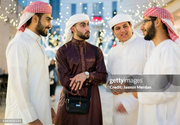 arab guys talking - middle east friends stock pictures, royalty-free photos & images