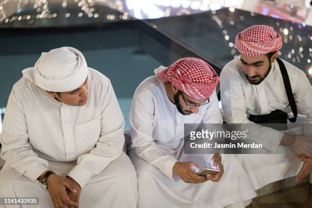 arab boys sitting and talking - amman people stock pictures, royalty-free photos & images