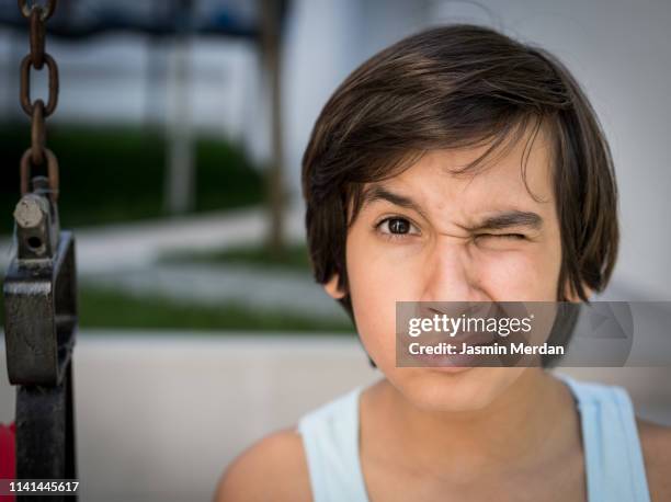 boy with blinking eye - eyelid stock pictures, royalty-free photos & images
