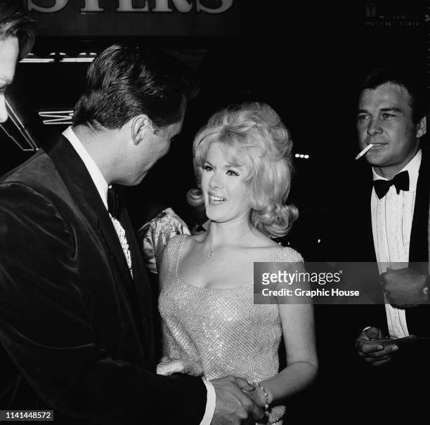 American actress, director and producer Connie Stevens and American actor James Stacy attend the premiere of 'The Unsinkable Molly Brown', US, 11th...