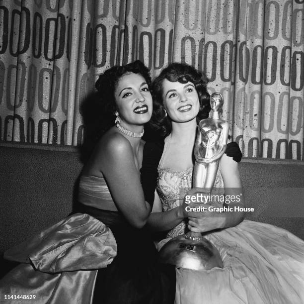 Mexican actress Katy Jurado holding her Golden Globe Award for Best Supporting Actress at The Foreign Press Association of Hollywood's Annual...