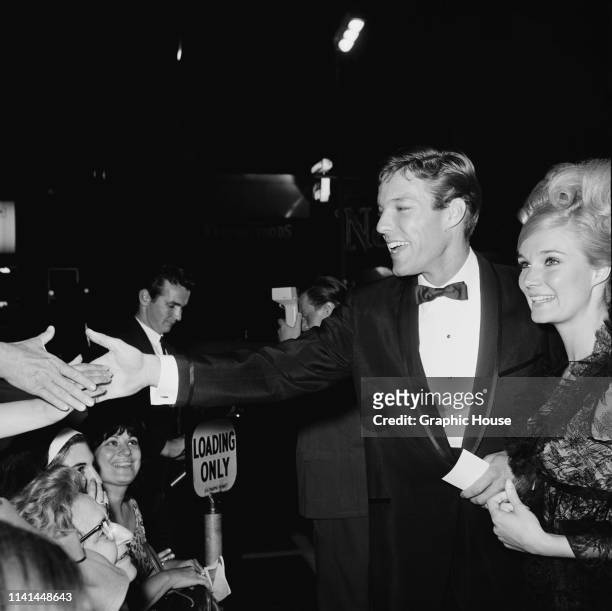 American actors Richard Chamberlain and Yvette Mimieux attend the premiere of 'The Unsinkable Molly Brown', US, 11th June 1964.