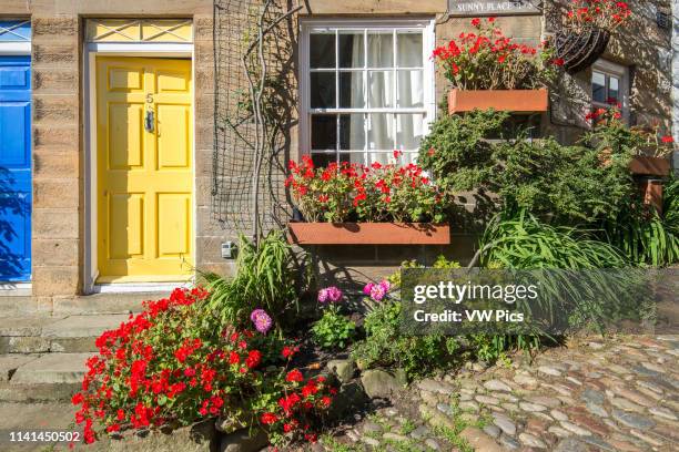 Welcoming yellow door, Robin Hoods Bay, Yorkshire, UK.