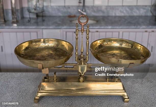 old weighing scale on a marble stand. - emreturanphoto stock pictures, royalty-free photos & images