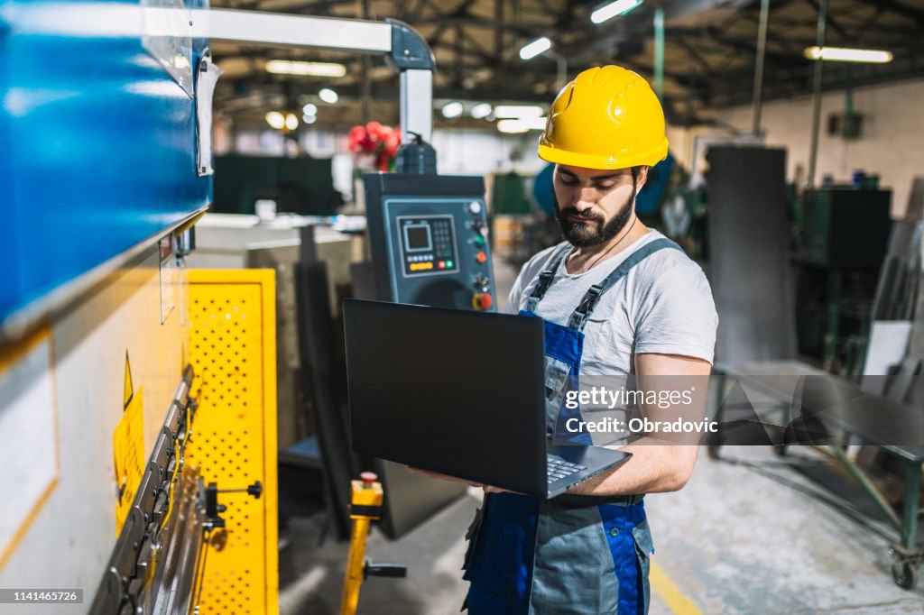 Person In Factory Factory Worker Controlling Production Man Working At A Factory High-Res ...
