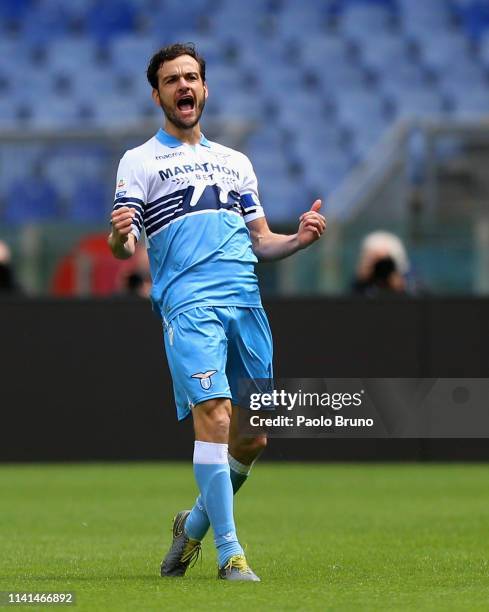 Marco Parolo of SS Lazio celebrates after scoring the opening goal during the Serie A match between SS Lazio and Atalanta BC at Stadio Olimpico on...