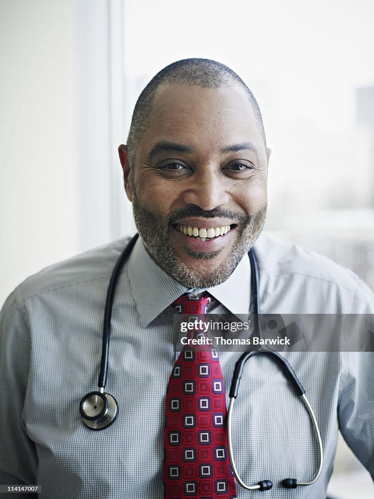 Mature male  doctor smiling portrait