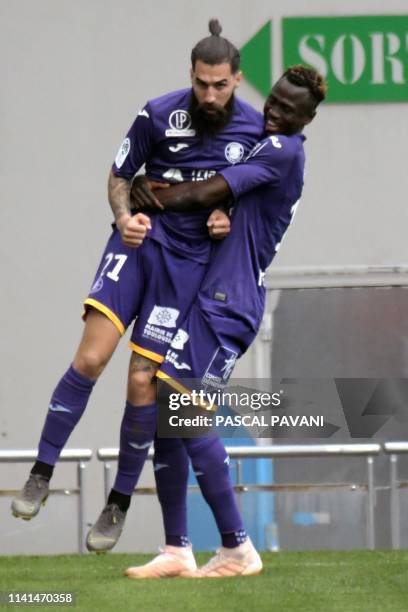 Toulouse's Swedish midfielder Jimmy Durmaz celebrates with teamate after scoring a goal during the French L1 football match between Toulouse and...