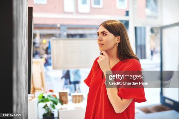 something has caught her full attention - woman art gallery stock pictures, royalty-free photos & images