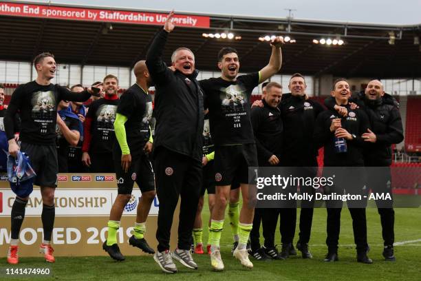 Chris Wilder the head / coach of Sheffield United and John Egan of Sheffield United celebrate promotion to the Premier League during the Sky Bet...