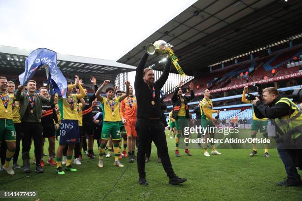 Norwich City manager Daniel Farke lifts the Championship trophy during the Sky Bet Championship match between Aston Villa and Norwich City at Villa...