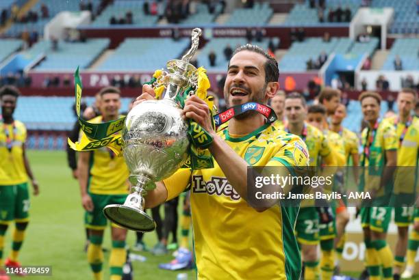 Mario Vrancic of Norwich City celebrates winning the Sky Bet Championship with the trophy after the Sky Bet Championship match between Aston Villa...