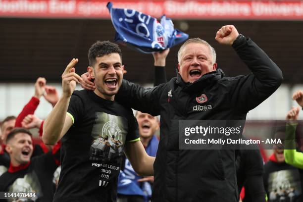 Chris Wilder the head / coach of Sheffield United and John Egan of Sheffield United celebrate promotion to the Premier League during the Sky Bet...