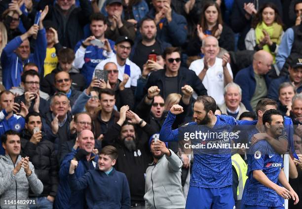 Chelsea's Argentinian striker Gonzalo Higuain celebrates scoring his team's third goal with Chelsea's Spanish defender Cesar Azpilicueta and...
