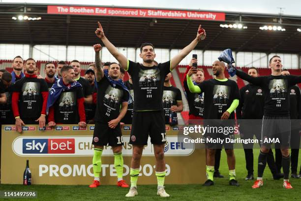 John Egan of Sheffield United leads the chant as Sheffield United players and staff celebrate promotion to the Premier League during the Sky Bet...